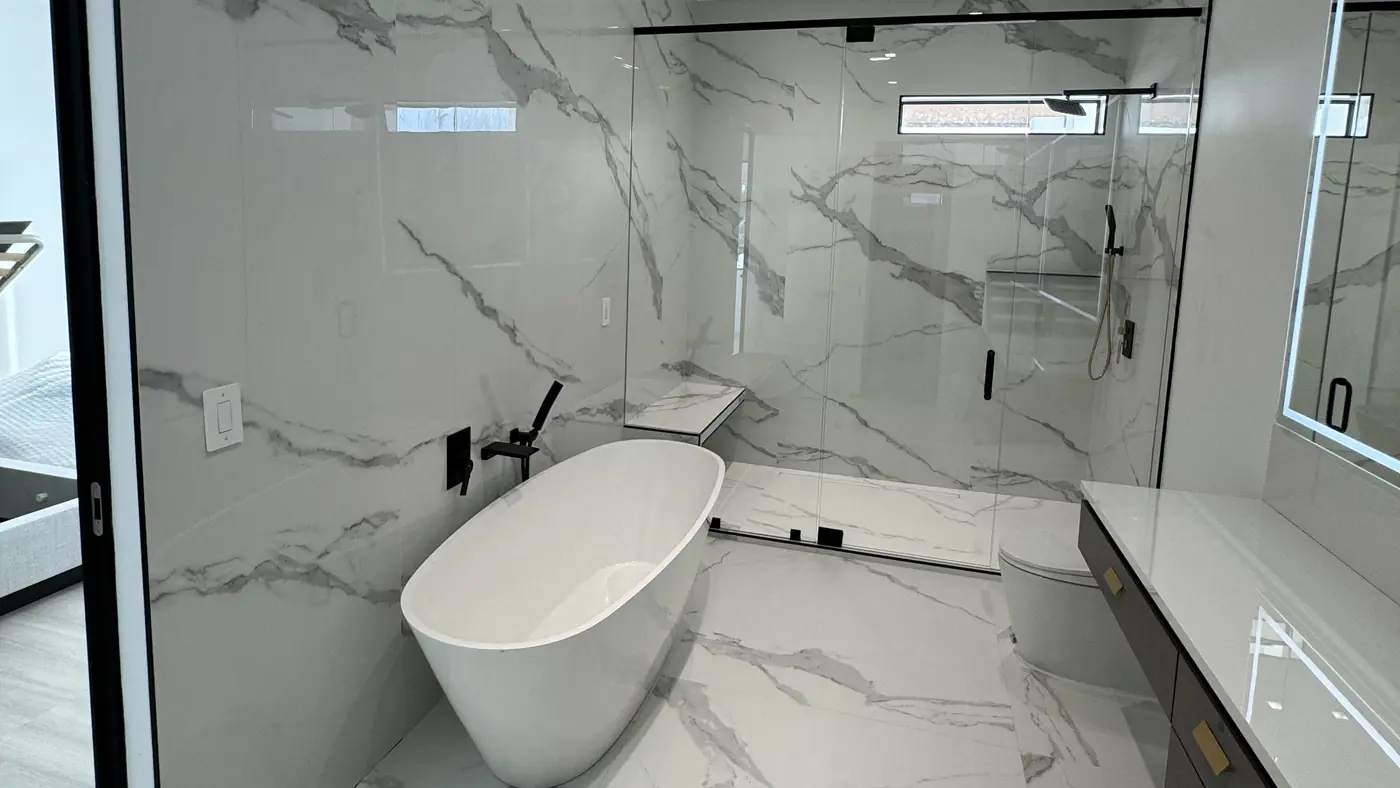 Master bathroom with a freestanding tub, walk-in shower and vanity