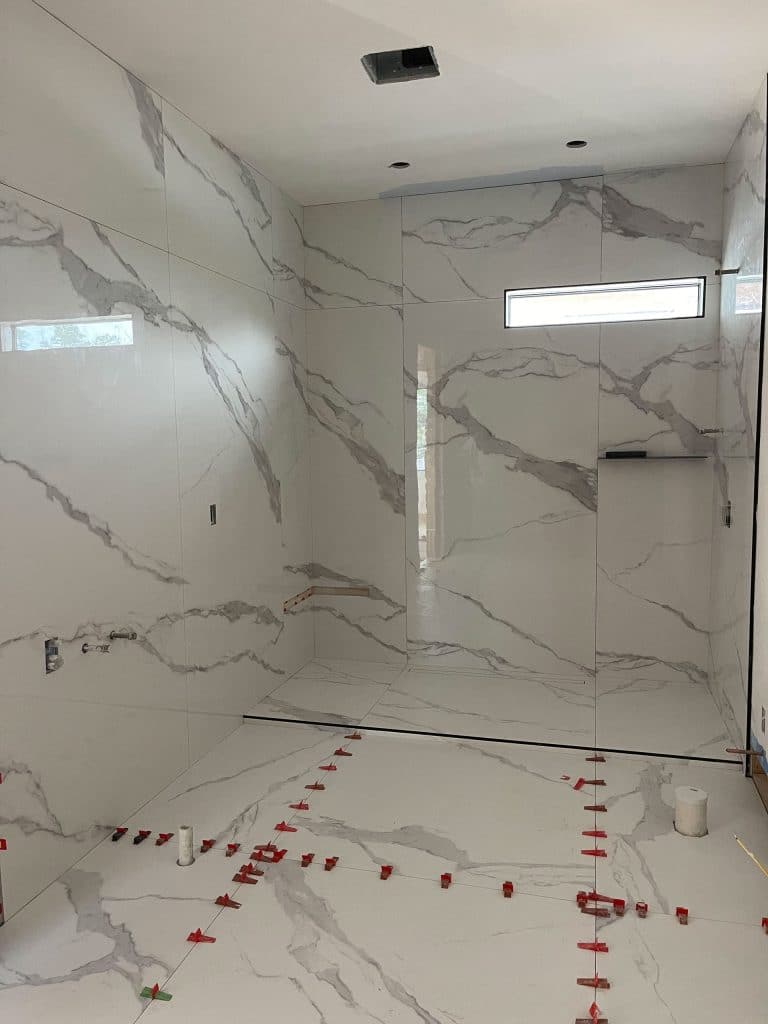 M&D Bathrooms and Floors installing a new luxury granite shower in a master bathroom in Bay County Florida