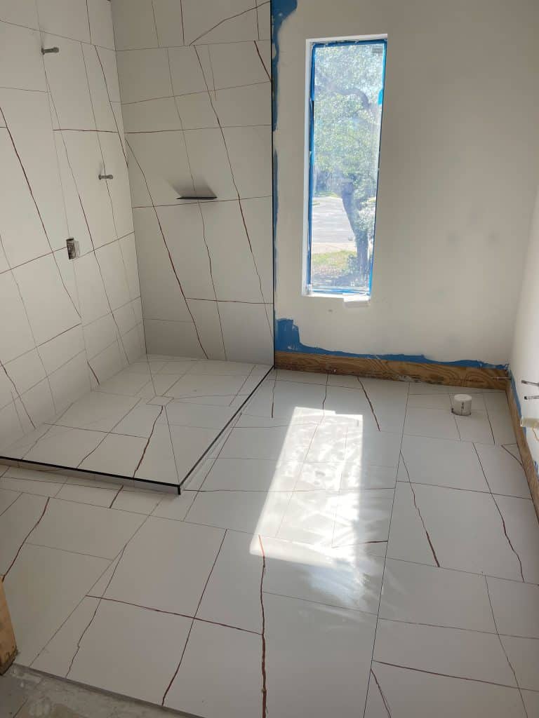 M&D Bathrooms and Floors installing a new luxury granite shower in a master bathroom in Bay County Florida