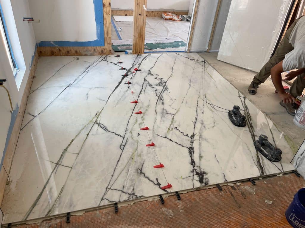 M&D Bathrooms and Floors contractors installing luxury granite floors at a home in Panama City